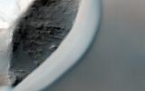 PIA18113: Dunes Streaming through Hills